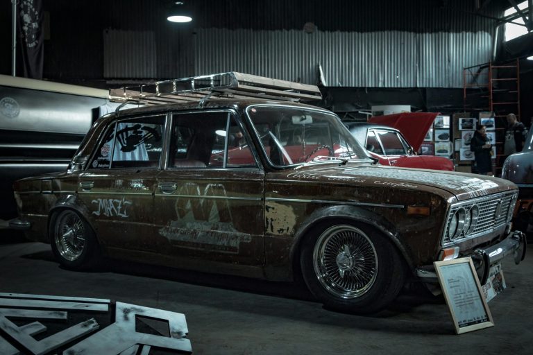 Rows of wrecked and damaged cars in a junkyard